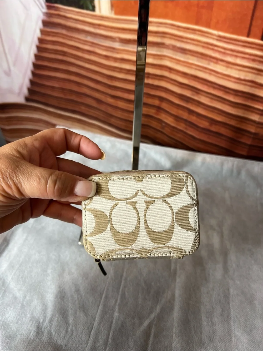Coach Poppy Signature travel pill case features a whimsical pink graphic 💖